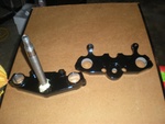 painted upper and lower tripples with bracket for headlight rubbers and steering stop painted upper and lower tripples with bracket for headlight rubbers and steering stop